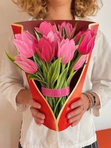 Woman holding life sized Pop-Up Flower Bouquet - Pink Tulips