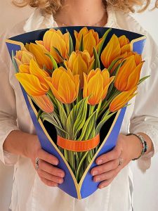 Woman holding life sized Pop-Up Flower Bouquet - Yellow Tulips